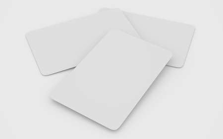 white plastic cards mockup deck of playing cards isolated on white table 3D rendering illustrationの写真素材