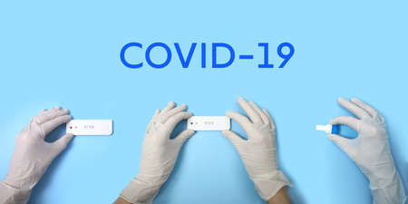 Express COVID-19 test for IgM and IgG antibodies to novel coronavirus SARS-CoV-2 in medical personal hands. Banner for rapid test in pandemicの写真素材