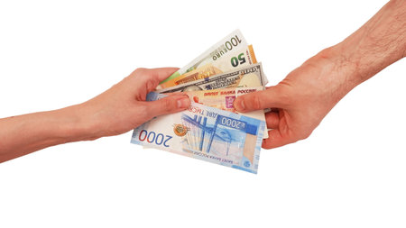 A woman and a man are holding multicurrency in their hands. Women's hands and euro, dollar, ruble....