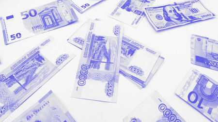 Top view of a multi-currency in very Peri tone. Euro, dollar, ruble banknotes isolated on white...