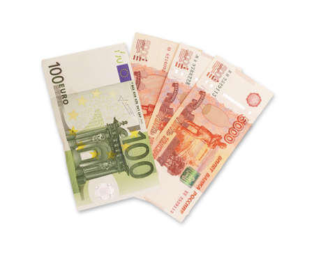 Top view of a multi-currency. Euro, dollar, ruble banknotes isolated on white background.Cash. The concept of financial literacy and savers. Stack of dollar , euro and ruble.の写真素材
