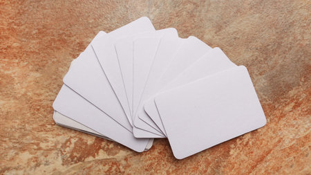 Playing cards modern mock up. Deck of playing card on a brown and beige marble surface.Blank white cards or business cards. Branding and holidaysの写真素材