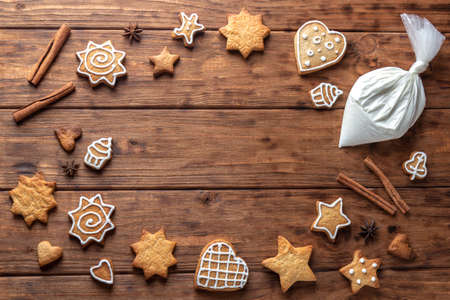 Frame of ginger cookies on a wooden background.の写真素材