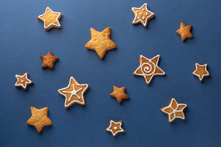 Ginger cookie stars on a blue backgroundの写真素材