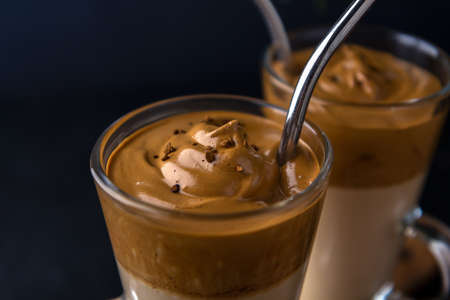 Whipped coffee with dalgon milk coffee. Close-up of foamの写真素材