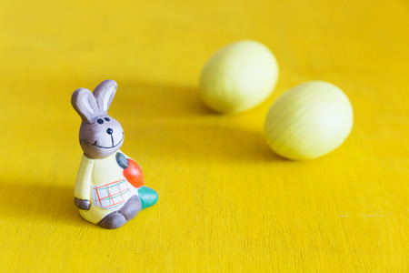 Easter rabbit dressed in apron. Easter postcard. Copy space.の写真素材