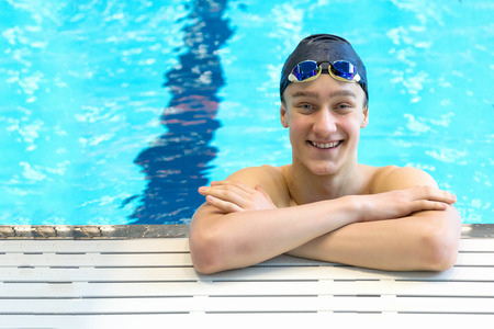 Happy teenager swimmer. Selective focus, copy space.の写真素材