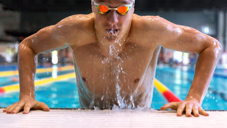 Professional swimmer emerges from the pool.の写真素材