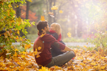 Father and daughter hug in autumn park.の写真素材