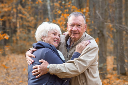 Portrait of happy senior couple hugging and smiling