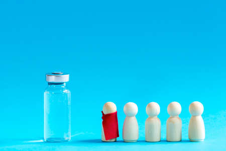 The queue of the wooden people waiting on vaccinationの写真素材