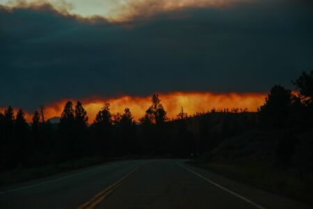 Road Trip during wildfires on the horizon in Arizona. Climate change, wildfires, dramatic views.の写真素材