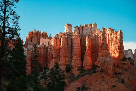Beautiful Bryce Canyon National Park in Utah, USA. Orange rocks, blue sky. Giant natural amphitheaters and hoodoos formations. Great panoramic views from vista points and breathtaking adventure.の写真素材