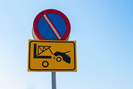Traffic sign - No Parking zone, evacuation on tow truck. Prohibited and tow away zone.の写真素材