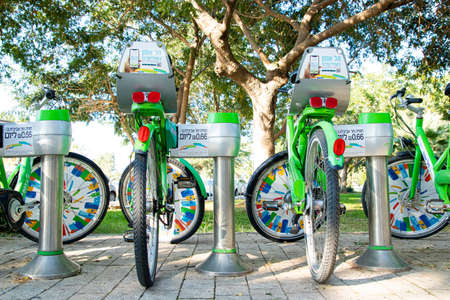 Tel Aviv, Israel - Dec. 18, 2019: Bicycle parking on the streets of Tel Aviv. Tel-O-Fun service offers 2000 bicycles which are spread around Tel-Aviv - Jaffa , as reachable as the palm of your hand.のeditorial素材