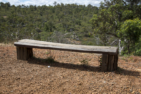 A wooden bench in John Forrest National Parkの写真素材