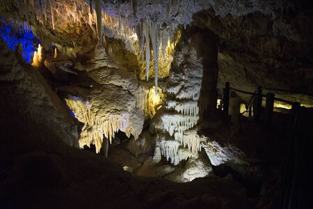 Illuminated Stalactites and stalagmites in Ngilgi cave in Yallingupの写真素材