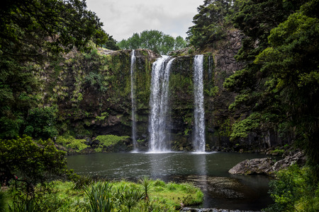 A scenic view of Whangarei waterfall and pond underneathの写真素材