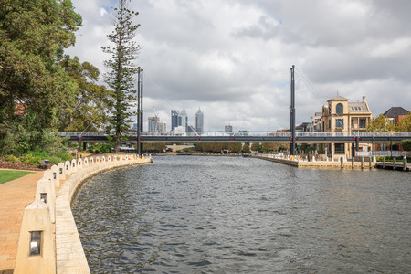 Pedestrian bridge across Swan river small harbour in East Perth suburb Western Australiaの写真素材