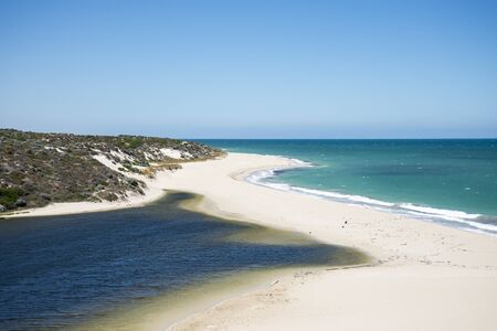 A close view of the beach where Moore river meets Atlantic oceanの写真素材