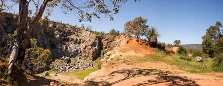 A view of a mountain quarry site from top of the rock in Greenmount National Park, Western Australia