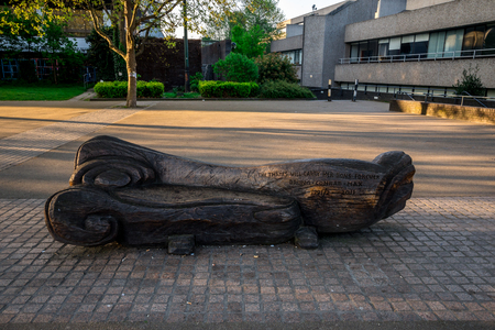 Scenic carved wooden memorial seat in front of National Theatre in London, Great Britainのeditorial素材
