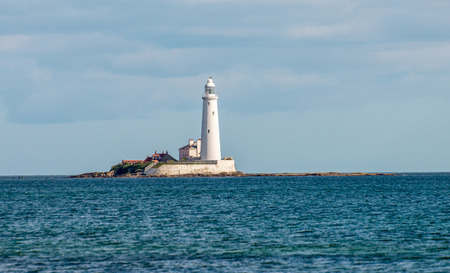 A lighthouse on an island in Whitley Bay near Newcastle upon Tyne, England, Great Britainの写真素材