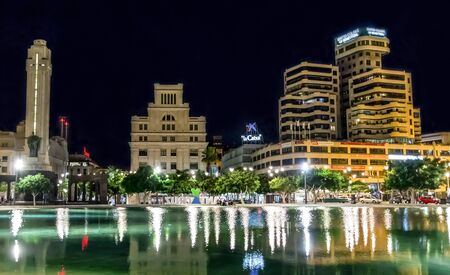 Night view cityscape of Santa Cruz de Tenerife reflected in a pool at Spain Square, Canary Islands, Spainのeditorial素材