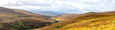 A scenic panorama of Cairngorms national park highlands landscape in autumn season, Scotlandの写真素材