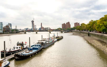 River Thames view from Albert bridge and boats parked near Battersea park embankment, London, Englandのeditorial素材