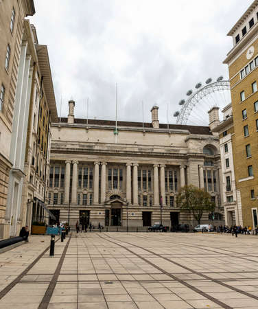 A street view from Forum Magnus Square County Hall and London Eye behind buildings, United Kingdomのeditorial素材