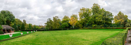 Chelsea bridge across Thames river from Battersea Park Chelsea suburb, London, United Kingdomのeditorial素材