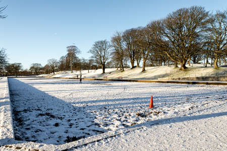 Various playground equipment outside in winter time in Seaton Park, Aberdeen, Scotlandの写真素材
