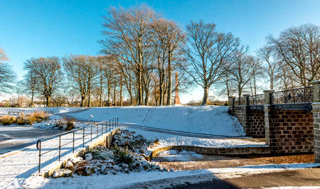 Seaton park central alley and St Machar's Cathedral covered by snow in winter season, Aberdeen, Scotlandの写真素材
