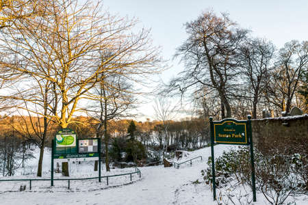 Entrance to Seaton park near St Machar's Cathedral and information stand with a park map, winter season, Aberdeen, Scotlandのeditorial素材