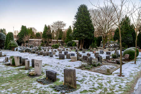 Frozen graves and flowers in Lagard cemetery in winter season, Stavanger, Norway, December 2017のeditorial素材