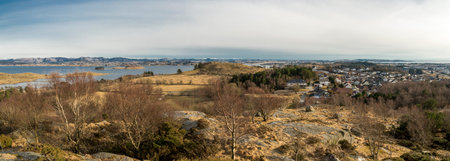 A view of Hafrsfjord fjord and Snode residential suburb from top of the hill in early spring season,...