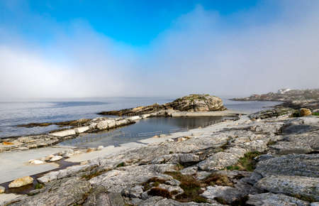 Walk path with a fence at scenic Sjobadet Myklebust public sea swimming pool in Tananger, Norway, May 2018の写真素材
