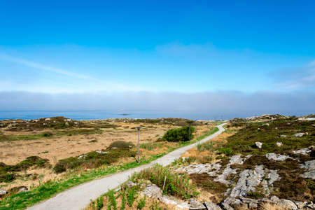 Walk path with a fence at scenic Sjobadet Myklebust public sea swimming pool in Tananger, Norway, May 2018の写真素材