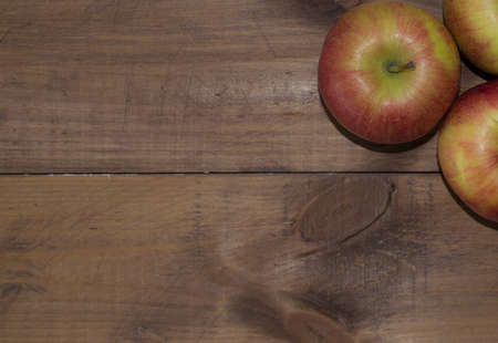 Apples on a wooden background. Proper diet. Healthy diet. Vegetarianism. Proper Breakfast. The right snack.の写真素材