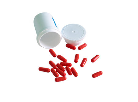 Medical capsules, supplements from jars isolated on white background.