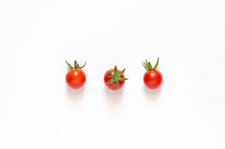 Cherry tomatoes isolated on a white background. Close-up. Copy space.