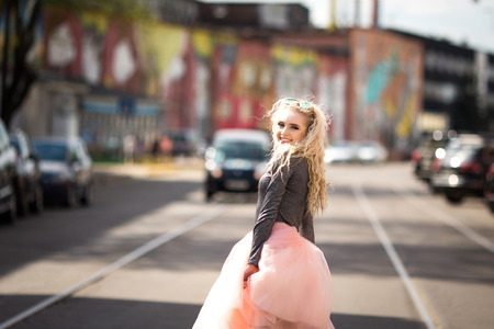 Very pretty girl walking down the streetの写真素材