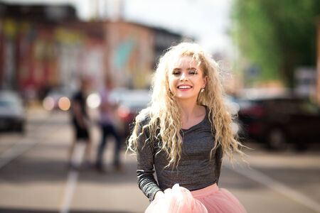 Very pretty girl walking down the streetの写真素材
