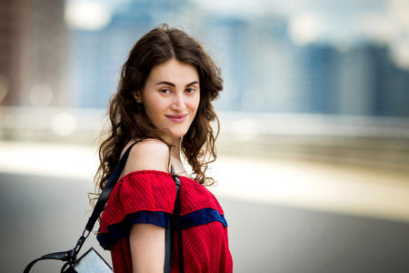 beautiful cute sexy  brunette girl walking around the city