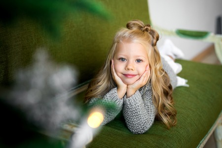 Portrait of a beautiful smiling little girl in the studioの写真素材