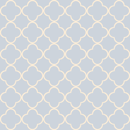 Seamless Moroccan style geometric quatrefoil pattern design in pastel yellow color on pastel blue backgroundの写真素材