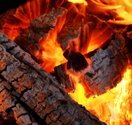 Decaying coals for cooking and a backgroundの写真素材