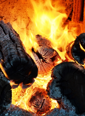 Decaying coals for cooking and a backgroundの写真素材
