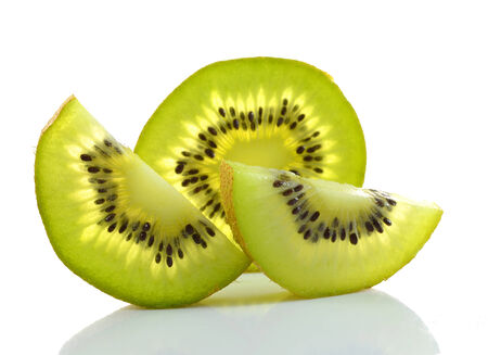 Whole kiwi fruit and his sliced segments isolated on white background cutoutの写真素材